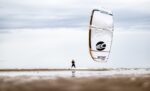 Cabrinha Switchblade Design Works kite flying over the beach
