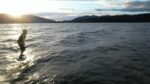 Riding river swell off throttle on a LiftX eFoil at sunrise in the Gorge